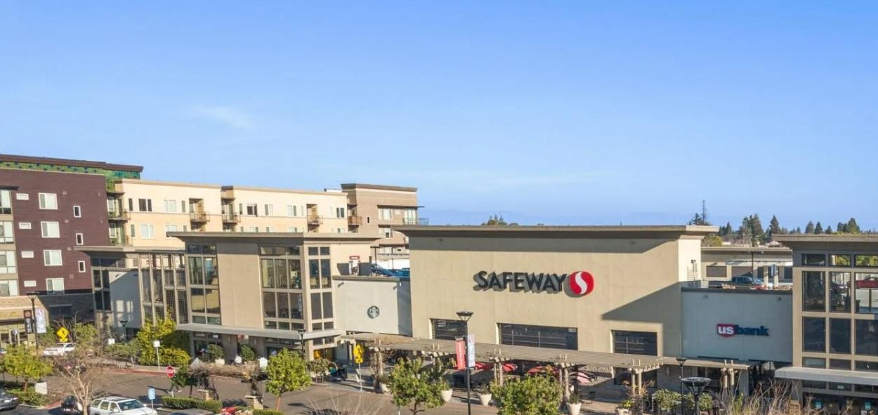 Completed Safeway storefront in a mixed-use center with residential floors above