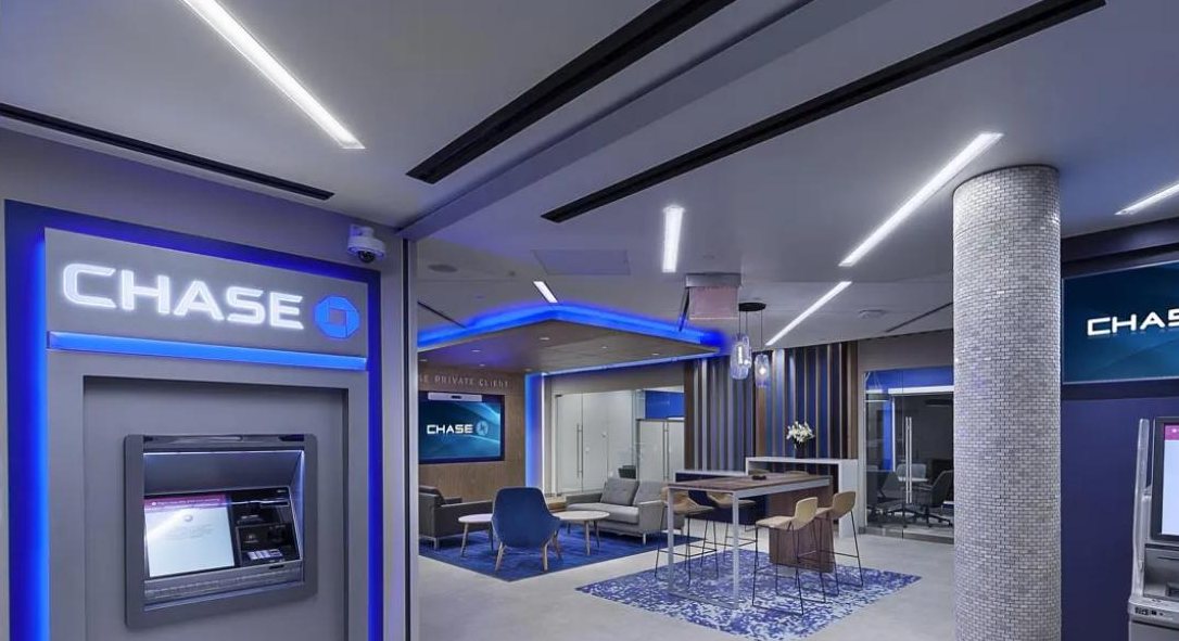 Finished Chase Bank branch interior with illuminated signage and lounge seating